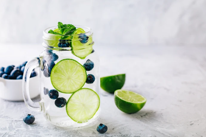 Cleartide C120i Freestanding makes drinking water an experience. Mason jar with chilled water with blueberries and lime.