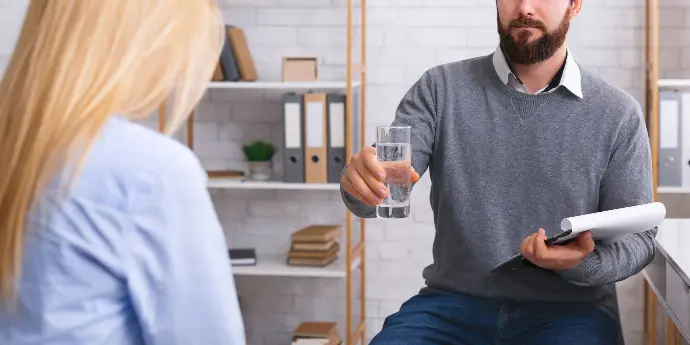 Man drinking Cleartide Hydration Systems water. 