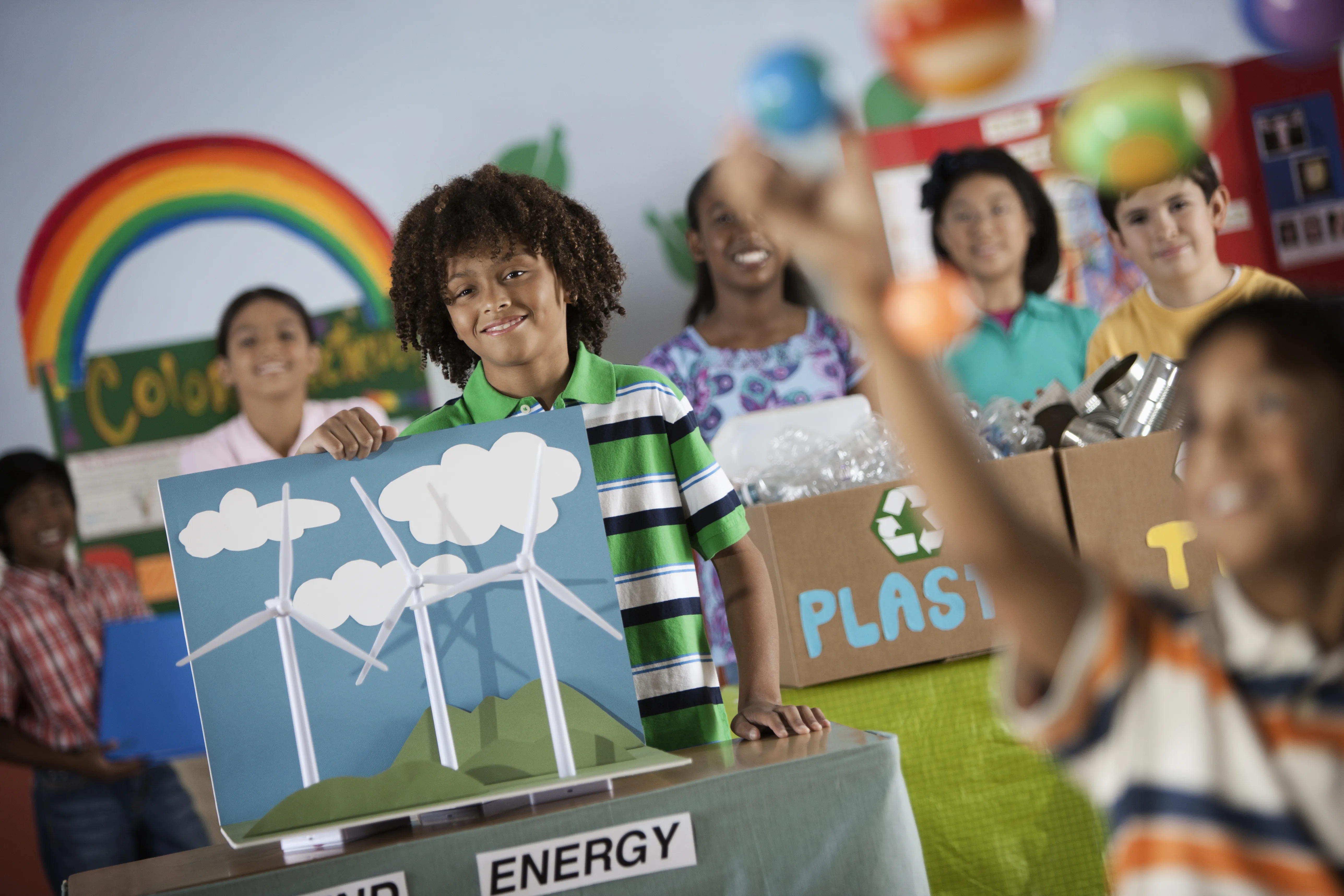 Children learning about sustainable practices in a classroom, highlighting the importance of clean, safe, bottle-less water solutions like CLEARTIDE in Boston.