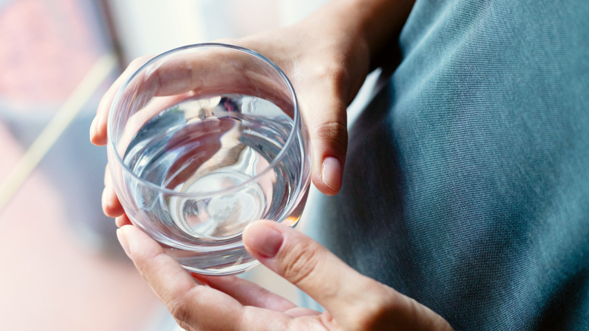 Image of human holding glass of water. Cleartide hydration: Providing the best bottleless water solutions in Massachusetts.